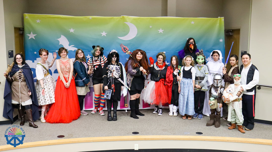 Group of children tweens and teens dressed in costumes for laman con cosplay contest.